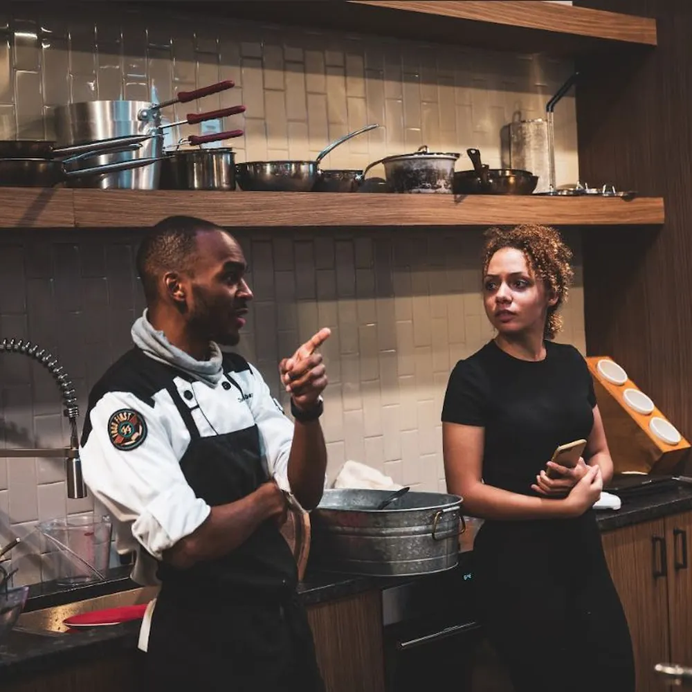 Chef Corey presenting at the Show + Tell demonstration kitchen