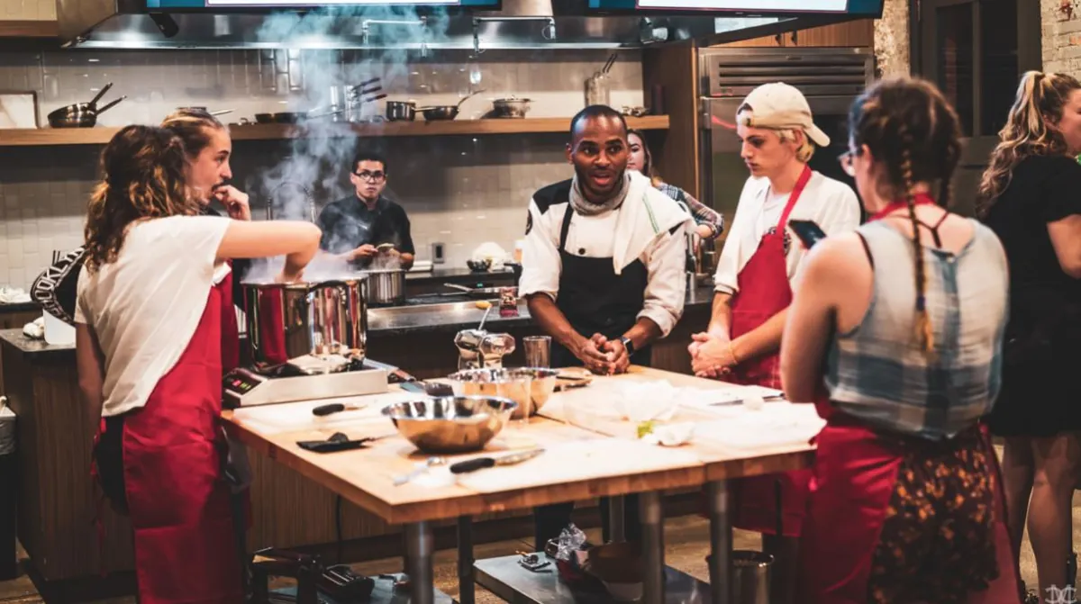 Participants cooking together during a class