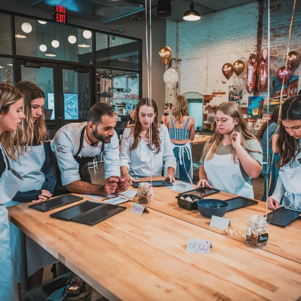 The full class seated together at the long table