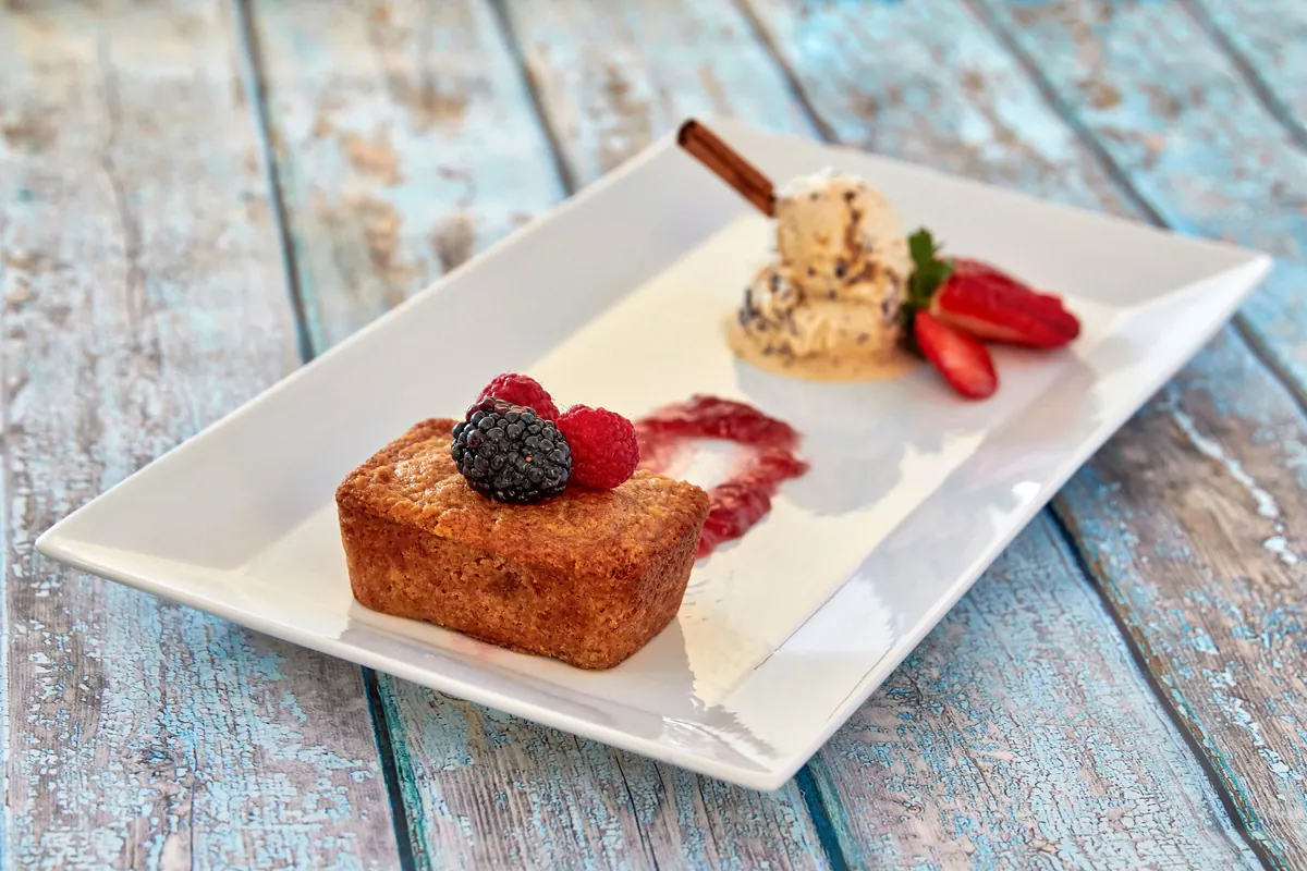 A plated dessert course with berries