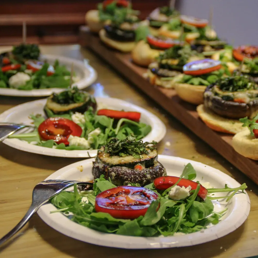Plated plant-forward canapés prepared for a dinner party