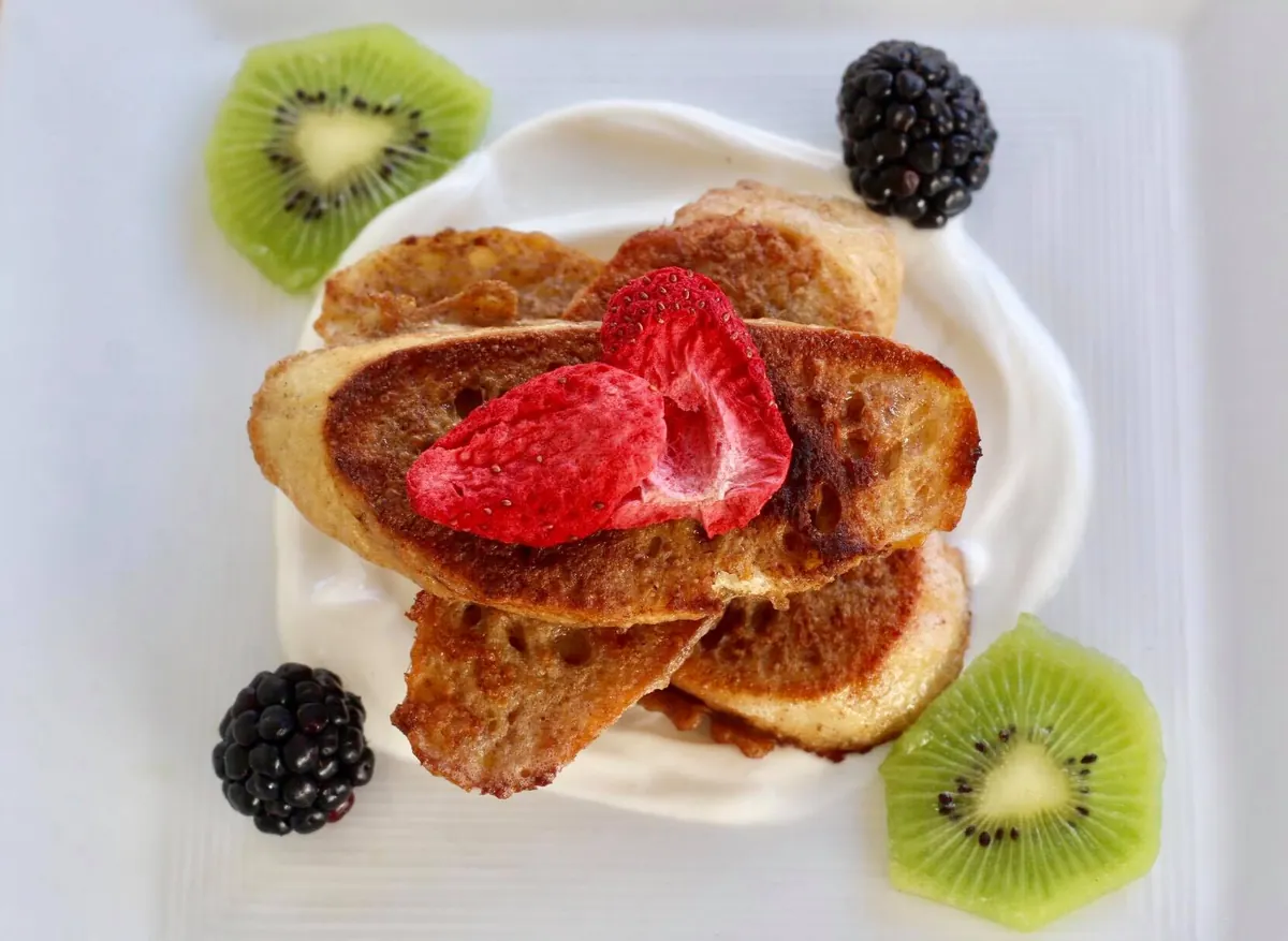 Plant-based French toast plated with berries