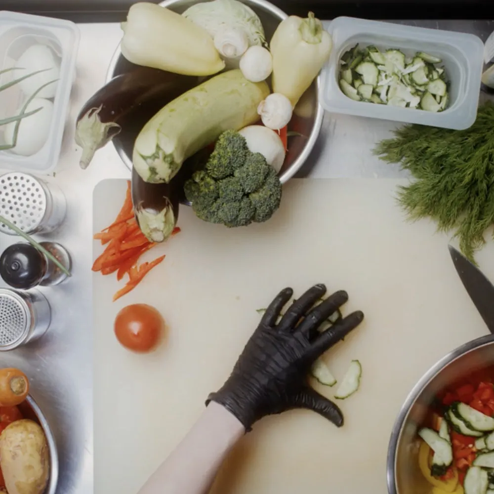 A prep station of fresh vegetables ready for a food education session